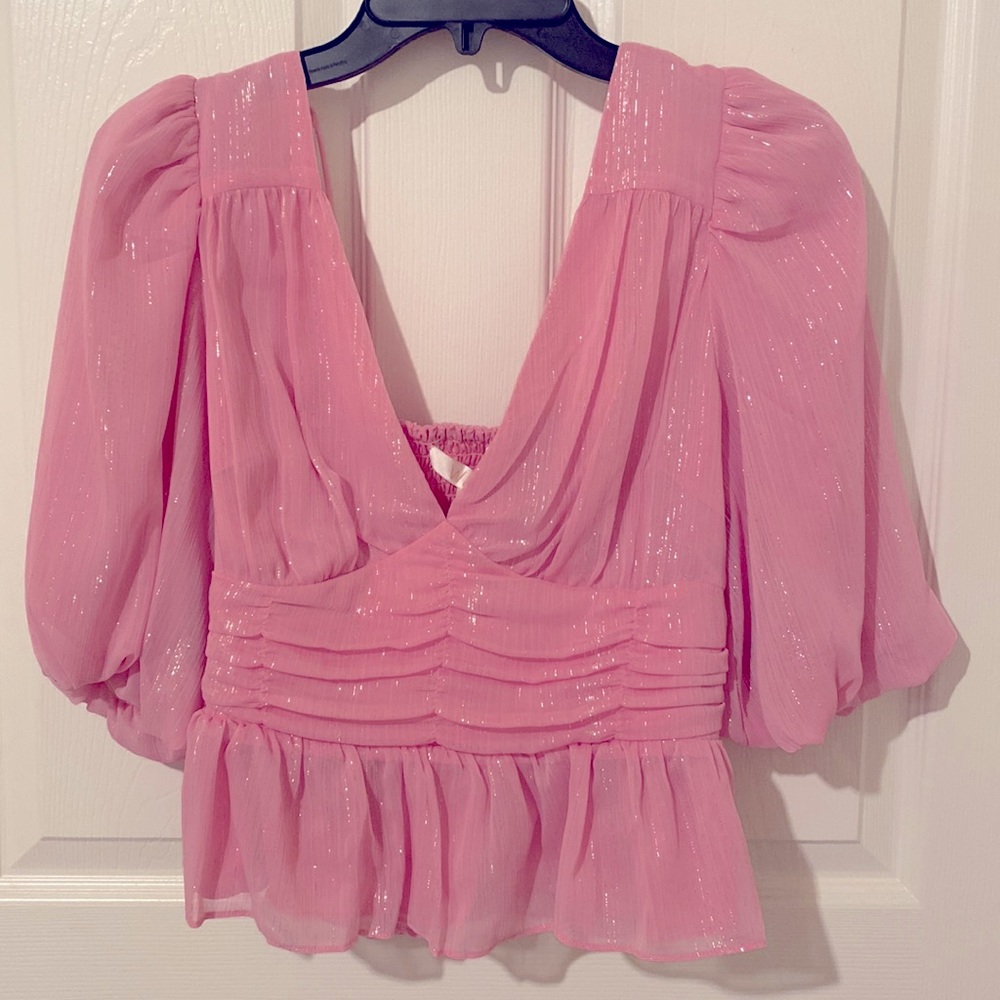 Beautiful Pink puff sleeve top with lined shimmers.